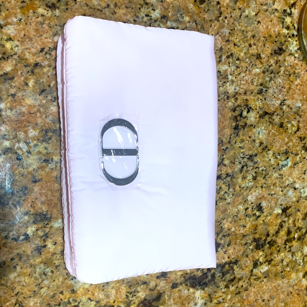 Authentic brand new puffy Christian Dior pink pouch/Clutch with Silver Accent.